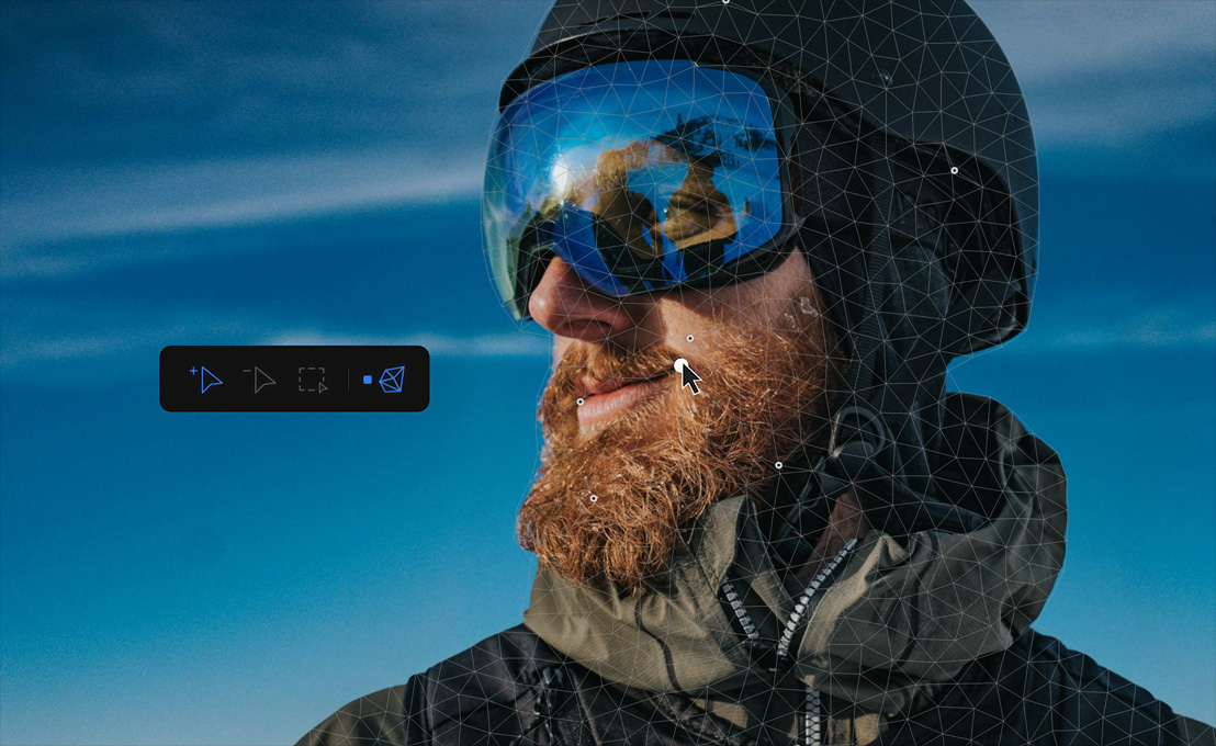 Image of man with beard wearing a helmet and eye-shield visor, blue sky background, computer mouse editing the image
