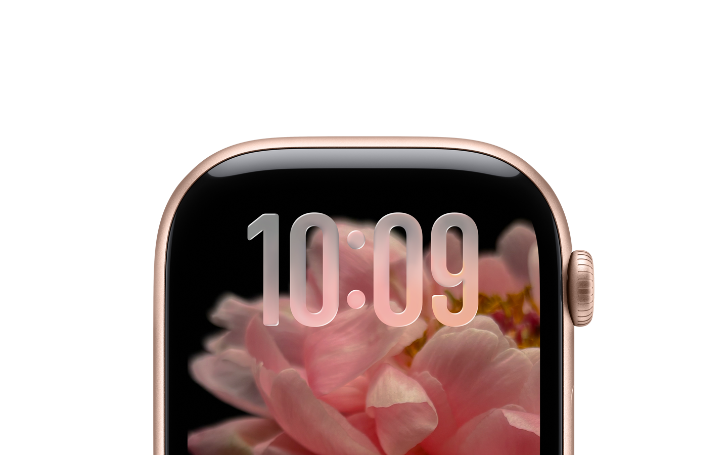 Un Apple Watch color oro rosa, sin correa, y sólo la parte superior de la carátula es visible, donde cerca del borde superior se aprecian números traslúcidos con el diseño con Liquid Glass